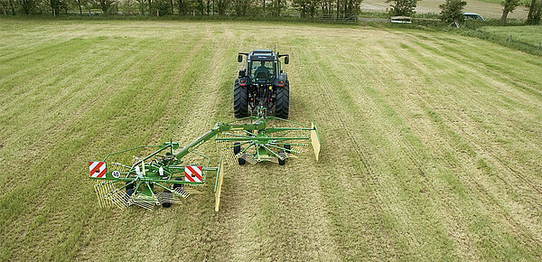Swathing all material to the left, forming a twin swath