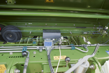 Applying twine, net and peripheral film